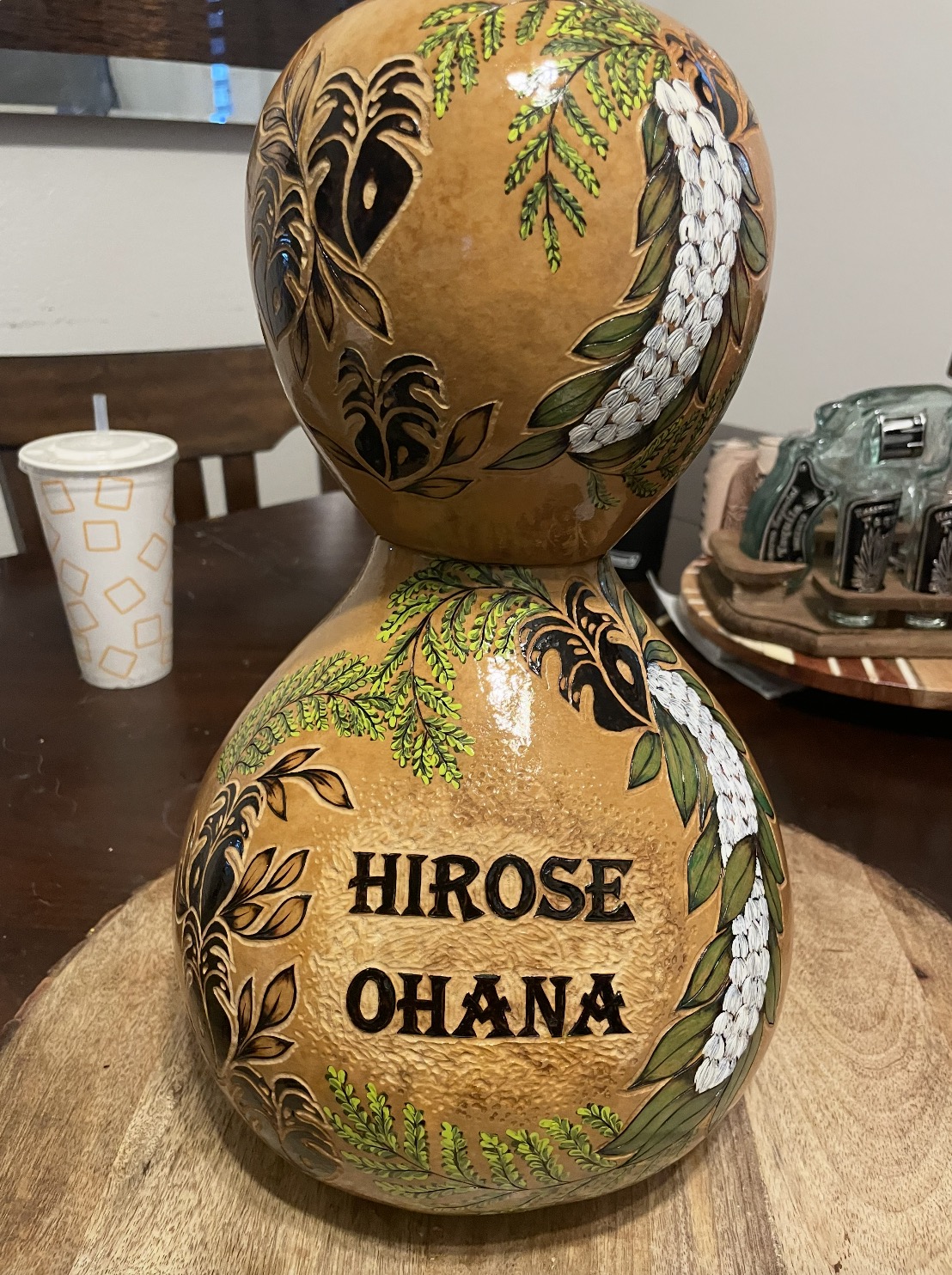 Hirose Ohana family ipuheke with maile lei